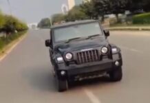 चलती थार से गुरुग्राम की सड़कों पर स्टंटबाजी पड़ी भारी, युवक पर लगा 26,500 रुपये का चालान Performing Stunt from Moving