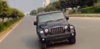 चलती थार से गुरुग्राम की सड़कों पर स्टंटबाजी पड़ी भारी, युवक पर लगा 26,500 रुपये का चालान Performing Stunt from Moving