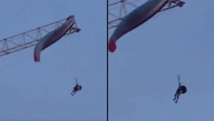 Paraglider stuck on crane Paraglider stuck on crane