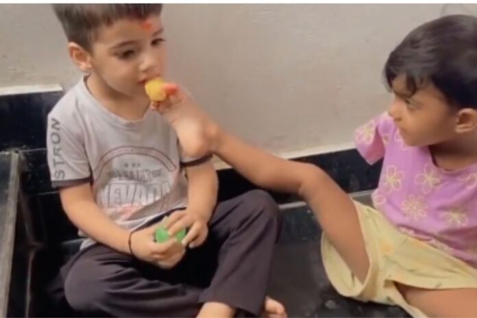 Sister Ties Rakhi to Brother With Her Feet Sister Ties Rakhi to Brother With Her Feet