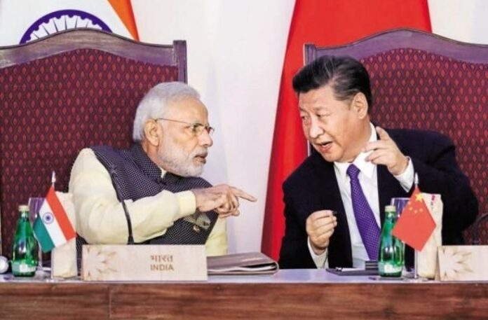 PM Modi and Xi Jinping shake hands PM Modi and Xi Jinping shake hands